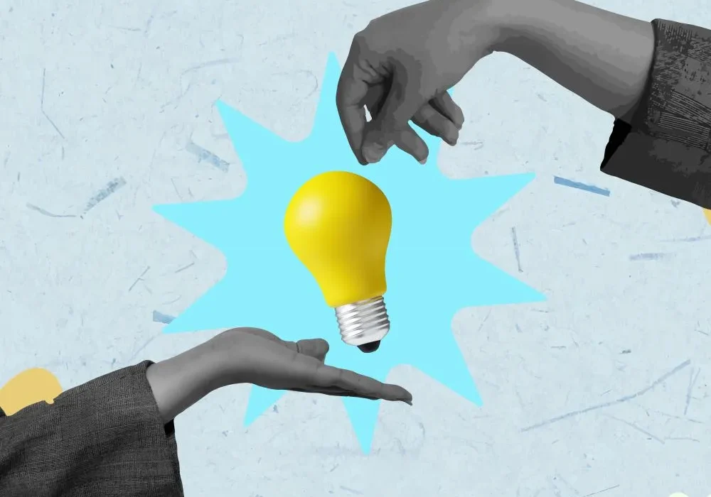 Visual representing social media management ideas for businesses in Dubai, symbolized by a light bulb exchanged between professional hands, reflecting strategy, creativity, and structured digital thinking.